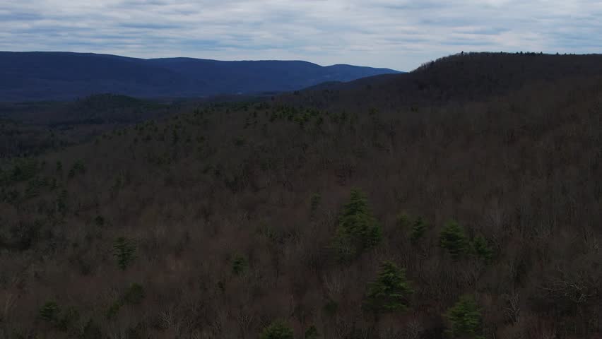 Scenic drone footage captures late autumn in the Appalachian mountains under a moody, cloud-laden sky.