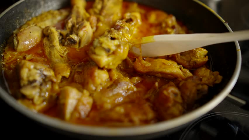 Fresh Homemade Stewed Chicken With Tikka Masala Sour Cream. Asia famous food. Chicken Dish in Pan. Thai chicken and peanut curry with rice. Cooking curry in pan. Healthy Food. Rice And meat Dish