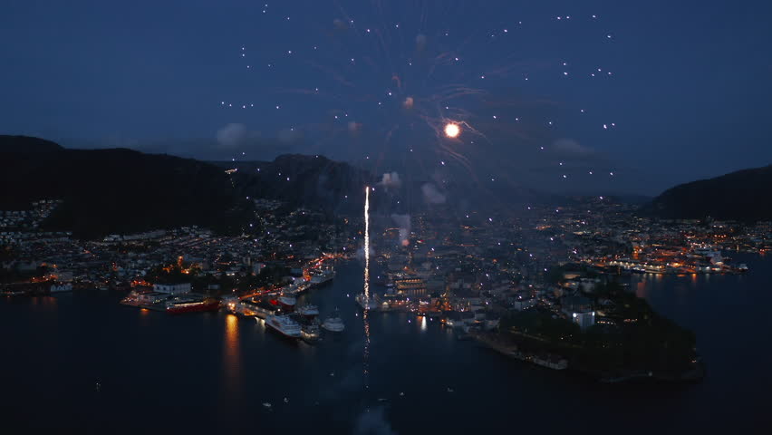 Beautiful close-up aerial shot of fireworks over Bergen, Norway on the constitution day May 17