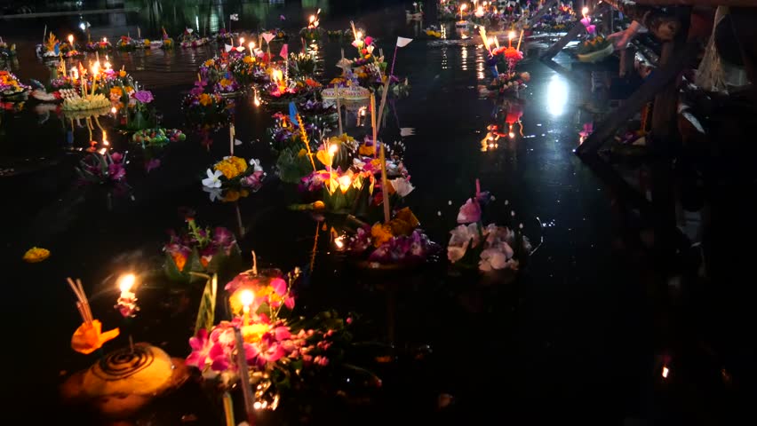 Krathongs floating on the water. Loy Krathong Festival (Festival of Lights) in Thailand. The celebration is used to show respect and thanks to the Goddess of water by using krathongs. 