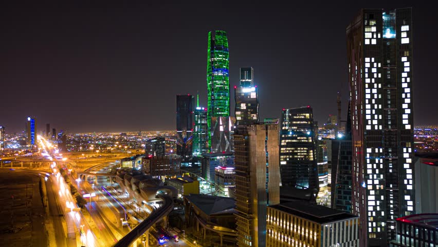 A stunning drone hyperlapse captures the KAFD towers at night, showcasing their illuminated beauty against the dark sky. This dynamic footage highlight modern skyline of Riyadh perfect for urban theme