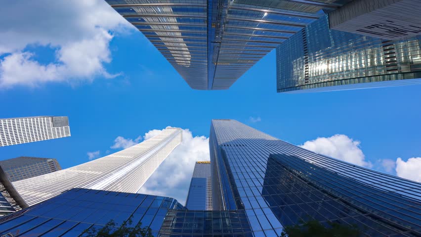 Looking up at the high-rise buildings in the city, the development of Chinese cities，High rise urban buildings, modern high-end office buildings, and commercial office buildings in Beijing, China