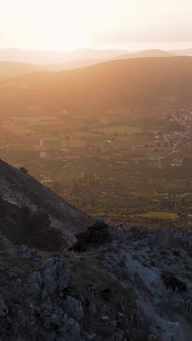 Sunset illuminating satellite dishes on mountaintop