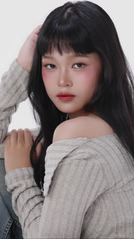 Vertical Beautiful Asian girl with make up and healthy skin on isolated white background. Teenager facial and skin care concept for commercial advertising.