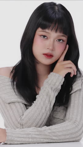 Vertical Beautiful Asian girl with make up and healthy skin on isolated white background. Teenager facial and skin care concept for commercial advertising.