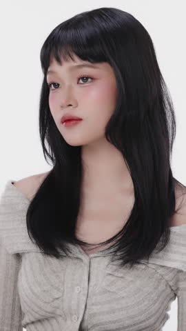 Vertical Beautiful Asian girl with make up and healthy skin on isolated white background. Teenager facial and skin care concept for commercial advertising.