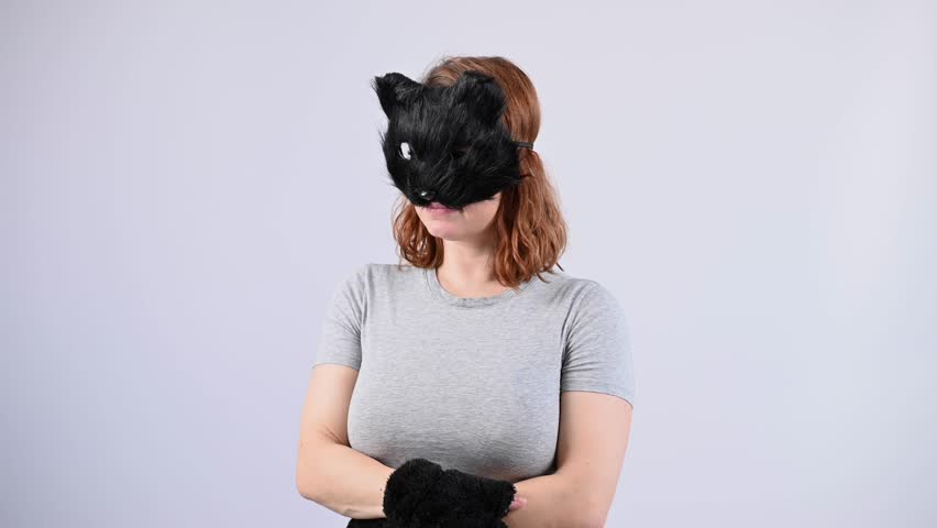 Portrait of a woman in a cat costume on a white background. Quadrober. 