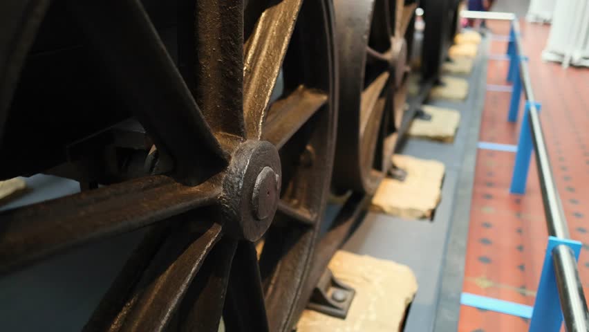 Close-up view of train wheels on display
