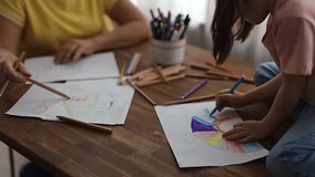 Grandmother and granddaughter happily create art together with colored pencils, enjoying their time - Powered by Shutterstock - Get 15% off with code: PIKWIZARD15