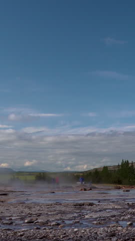 Geysir destrict in Iceland. The Strokkur Geyser erupting at the Haukadalur geothermal area, part of the golden circle route, in Iceland. Vertical footage