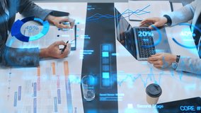 Top View of a Business Meeting With Interactive Holographic Data Visualizations. Professionals Analyze Charts, Graphs, and Percentages Projected. AI Technology in Modern Corporate Revenue Growth - Powered by Shutterstock - Get 15% off with code: PIKWIZARD15