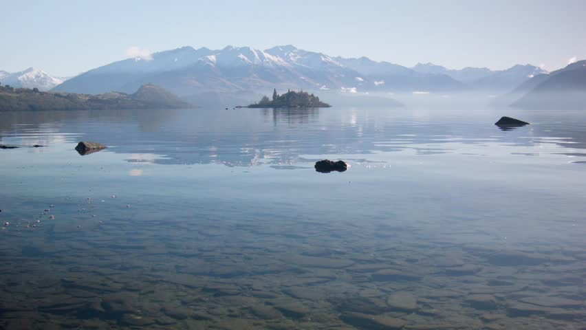 Ruby Island as seen low over the water of Lake Wanaka, New Zealand, on a clear day