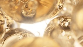 Gold cosmetic serum with liquid bubbles in a 3D abstract background. Hydrating essence gel enriched with collagen molecules. Moisturizing cream or oil for advanced skincare, beauty, and skin health.  - Powered by Shutterstock - Get 15% off with code: PIKWIZARD15