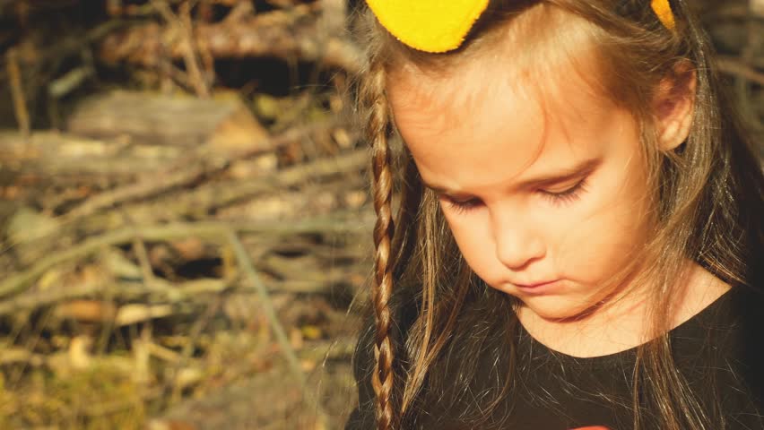 Portrait of smiling girl trick or treating in halloween costume. Childhood, tradition and halloween concept.