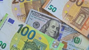 Cash USD and EURO money bills background. Paper money, currency cash. Top view one hundred US dollar and different Euro banknotes in close up macro view. - Powered by Shutterstock - Get 15% off with code: PIKWIZARD15