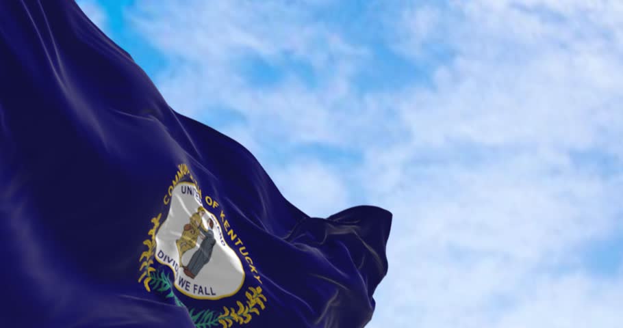 The US state flag of Kentucky waving. Kentucky flag features state seal. Seamless 3d render animation. Slow motion loop. Selective focus