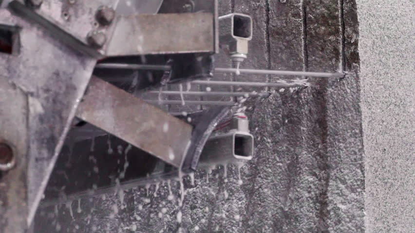 Heavy Machinery Cutting Natural Stone Block At Mineral Manufacturing Factory. Diamond Wires Cutting Granite Stone Blocks. Water Cooling Granite. Cutting Granite Stone Blocks For Resource Production