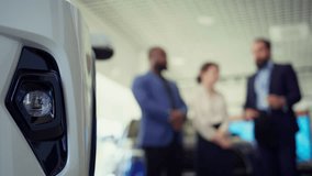 Car dealership salesman offering business cards to customers after negotiating vehicle prices, waiting for final answer. Agent giving visiting cards to clients, waiting for their call, camera B - Powered by Shutterstock - Get 15% off with code: PIKWIZARD15