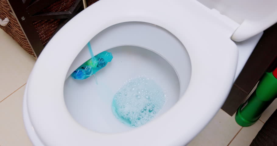Efficient Toilet Cleaning Process Utilizing Blue Foam and a Brush for Optimal Results
