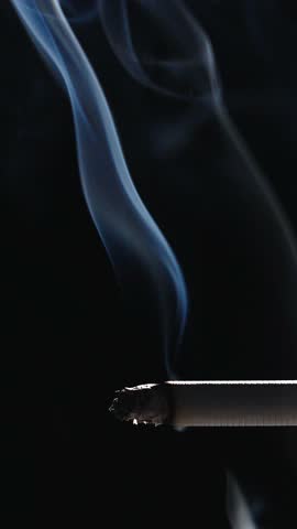 Cigarette smoking closeup balck background