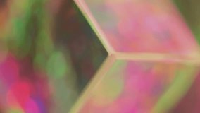 Blurred background. Sparkling prism. Pink red blue yellow circles spinning transparent glass cube purple bokeh reflections abstract neon motion free space. - Powered by Shutterstock - Get 15% off with code: PIKWIZARD15