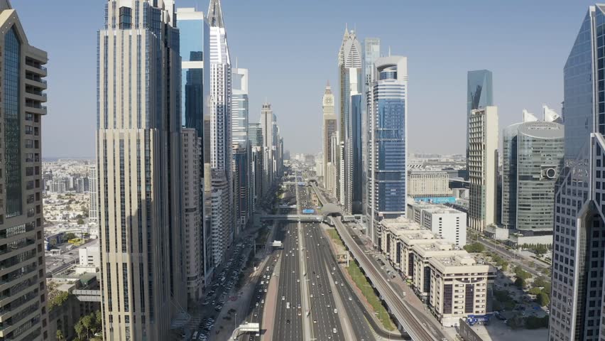 Marvel at Dubai's stunning skyline! Witness iconic skyscrapers like the Burj Khalifa, luxurious hotels, and futuristic architecture that define this dynamic, world-famous cityscape.