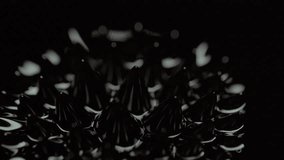 A closeup macro footage of the magnetic ferrofluid liquid in motion, on a blurred black background - Powered by Shutterstock - Get 15% off with code: PIKWIZARD15
