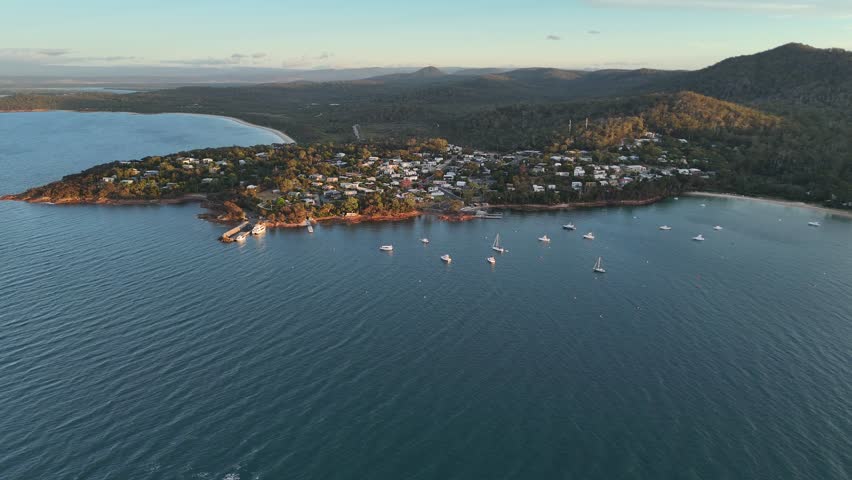 Sailboats at Coles bay in Hobart city during sunset, Tasmania, aerial shot wide angle