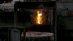 Molten Metal Pouring into Crucible - Foundry, Industry, Steel, Iron, Liquid, Hot, Fire, Sparks, Manufacturing, Smelting, Casting, Metallurgy, Industrial Process - Powered by Shutterstock - Get 15% off with code: PIKWIZARD15