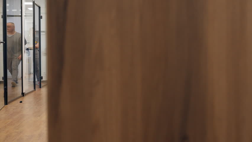 corridor professional laboratory for making dental prosthesis veneers glass doors modern office man specialist walking down corridor