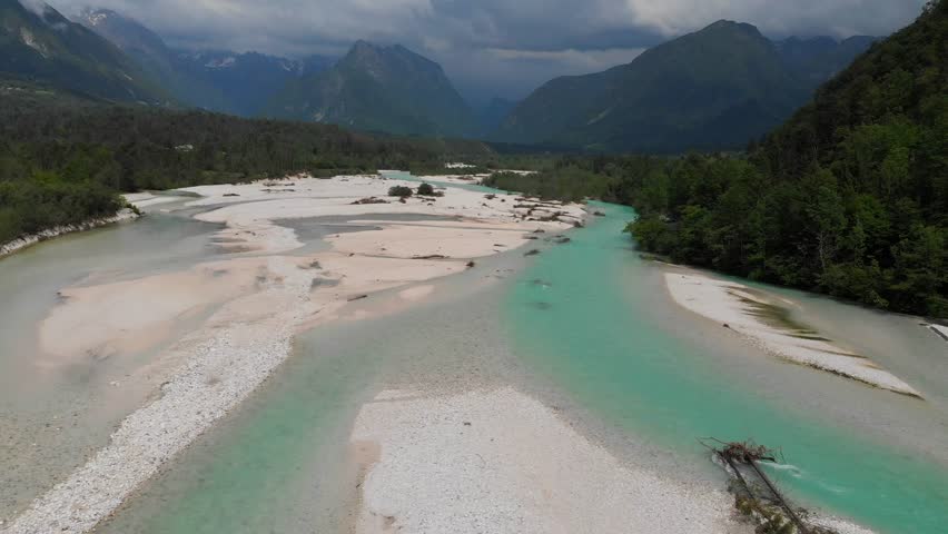 narnia movie location, drone flying above soca river in slovenia, overcast summer day
