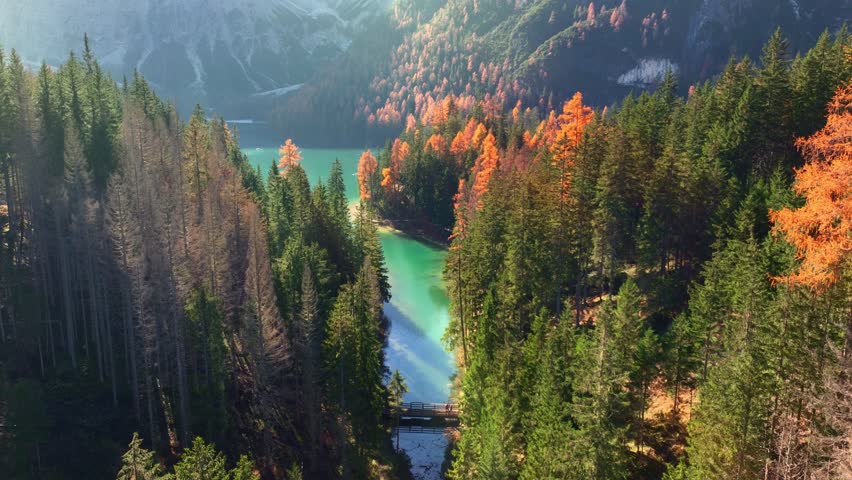 Autumn Aerial View of Lake Braies in Dolomiti Alps in Italy. Alps in Italy on a sunny day in autumnal famous travel destination in the Dolomites, Lago di Braies in the fall