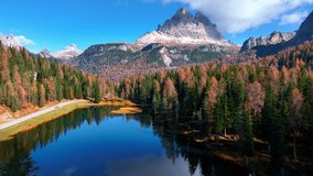 Aerial view of autumn in the Dolomites in Italy, beautiful lago di Antorno in the Dolomite mountains, drone view of Tre Cime di Lavaredo national park in Italy in autumn - Powered by Shutterstock - Get 15% off with code: PIKWIZARD15