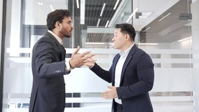 Two angry businessmen arguing intensely in modern office setting, showcasing conflict and emotion during heated business discussion or disagreement. Colleagues aggressive fight, disputing, quarreling - Powered by Shutterstock - Get 15% off with code: PIKWIZARD15
