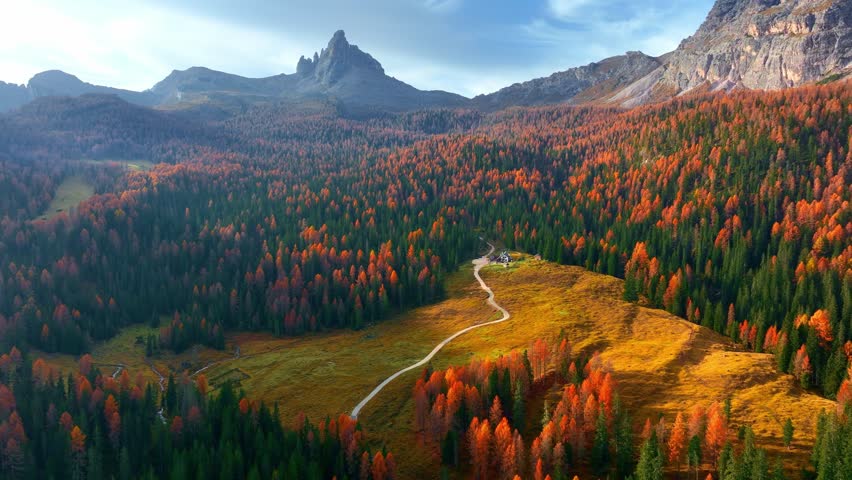 Aerial drone view of autumn forest in the Dolomites, hiking in Italian Alps near Cortina d Ampezzo, travel in Dolomite mountains Italy.