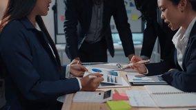 Business team discussing financial data and formulating a growth strategy in a collaborative office environment - Powered by Shutterstock - Get 15% off with code: PIKWIZARD15