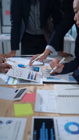 Business colleagues discussing financial data while developing strategies for growth and enhancing collaboration in the office
