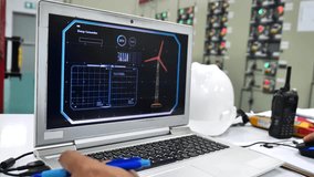 4K Video of Monitoring Wind Turbine Energy Output on Computer Screen - Renewable Energy, Environmental Conservation, and Future Sustainability Concepts - Powered by Shutterstock - Get 15% off with code: PIKWIZARD15
