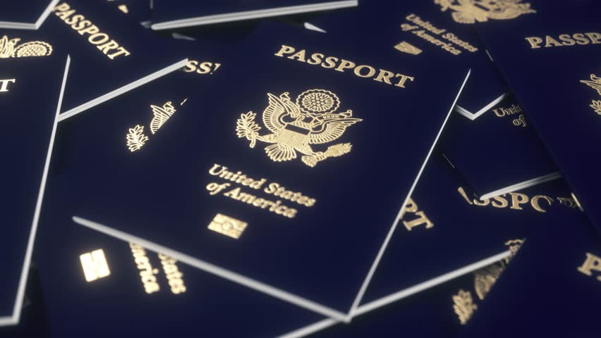 USA American passports on table. United States immigration, citizenship, travel and tourism concept