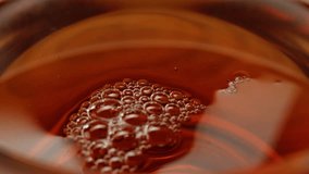 Pouring milk into black english breakfast tea in glass cup. Drinking hot tea with milk, healthy morning, freshly brewed detox drink. - Powered by Shutterstock - Get 15% off with code: PIKWIZARD15