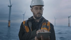 Offshore Wind Farm Engineer Using Tablet At Sea Technology Innovation Development - Powered by Shutterstock - Get 15% off with code: PIKWIZARD15