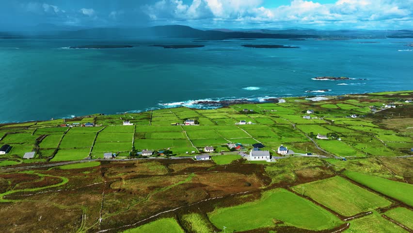 A Stunning and Vibrant Coastal Landscape Featuring Lush Green Fields and Clear Blue Waters