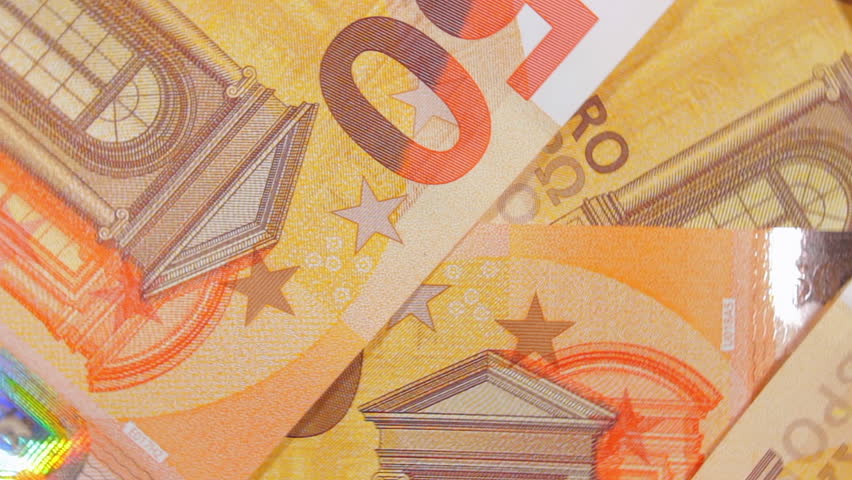 50 Euro Banknotes, Rotating Money Background - Top View. Euro Money Currency. Orange Paper Money. A Lot of Fifty Euro Bills. Business, Finances, Cash and Money Saving Concept - Slow Rotation Right - Powered by Shutterstock - Get 15% off with code: PIKWIZARD15