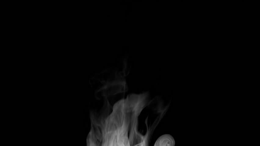 Trickle of Steam Slowly Rising from the Cup. White steam rises light, graceful twists on a black background. Slow motion. Footage is perfect for the layer with different blending modes.