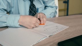 Young student studying geometry using a square ruler on his notebook - Education concept - Powered by Shutterstock - Get 15% off with code: PIKWIZARD15