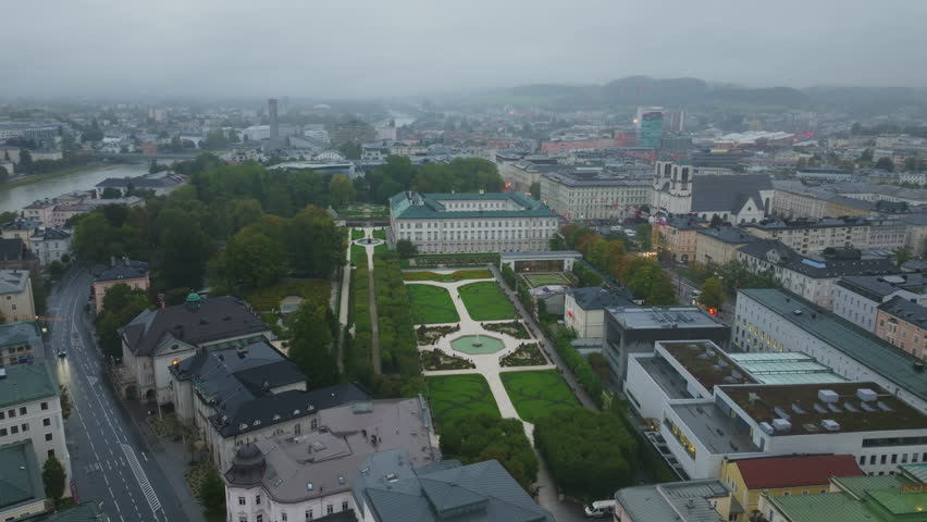 Aerial perspective of Mirabell Palace, showcasing the formal gardens and surrounding cityscape of Salzburg, Austria