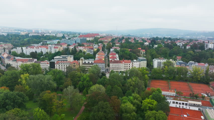 Brno, Czech Republic, seen from above. Parks and green spaces blend with the urban fabric, while historic architecture lines the streets