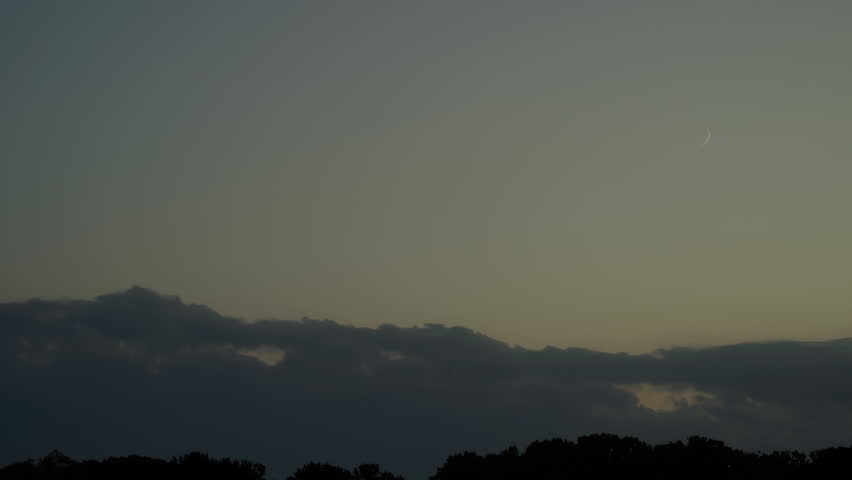 Crescent moon in the western sky at dusk, birds and insects singing, ProRes, 2x speed