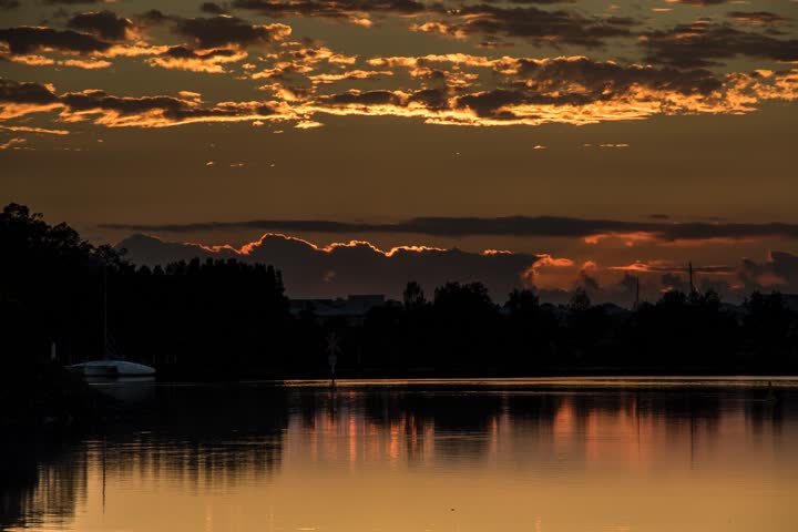4K Timelapse of Sunrise over the Lake, Golden Hour