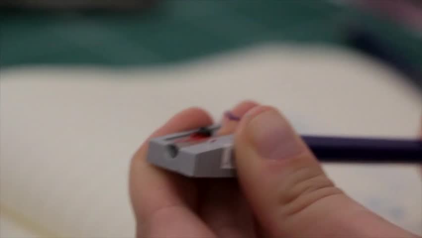A compact pencil sharpener quickly refines pencil tips, creating precise, clean points for smooth writing.